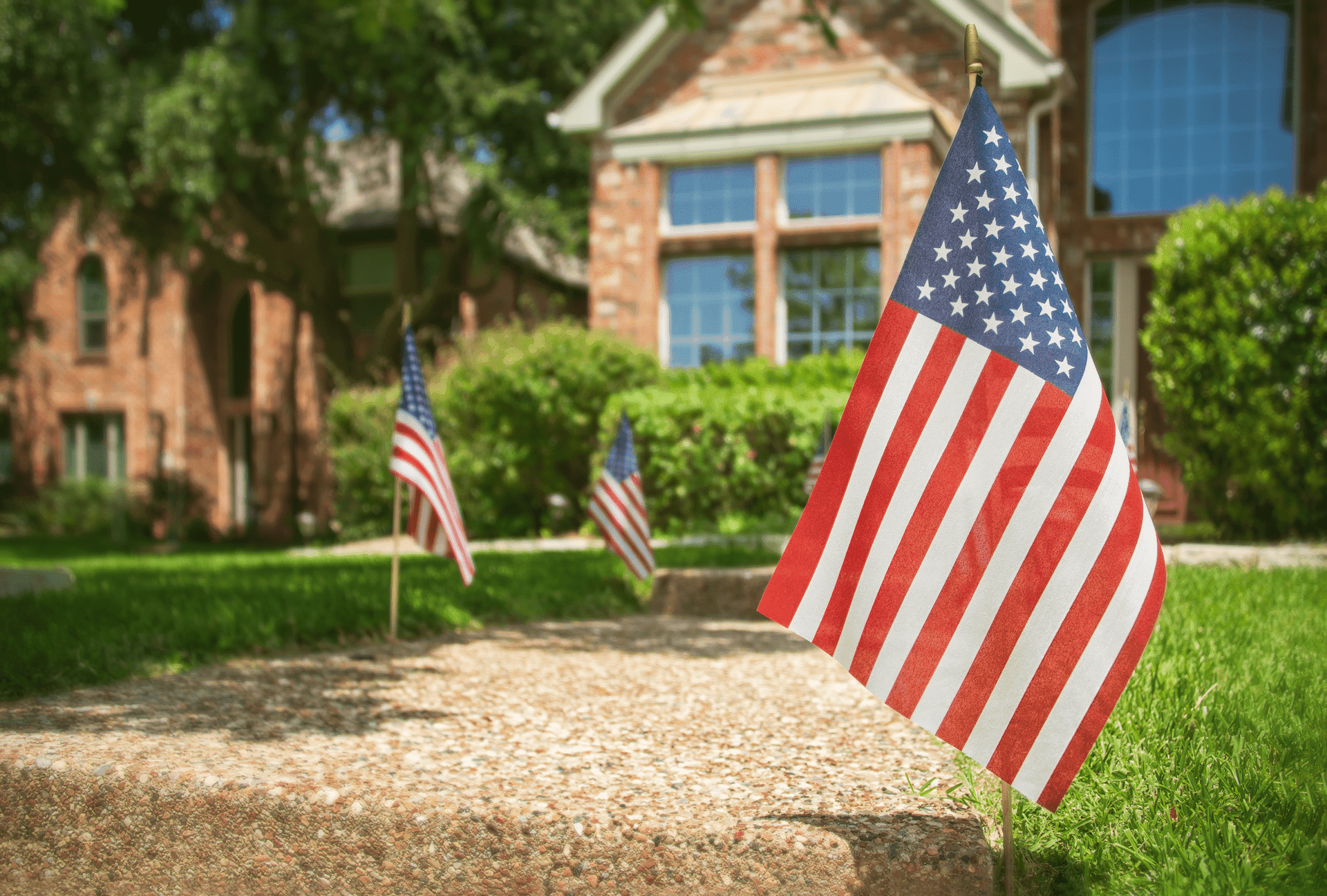 American flags alongside sidewalk